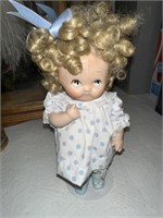SMALL PORCELAIN DOLL AND STAND