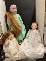 Three Porcelain dolls.