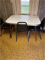 Vintage table with 3 office chairs