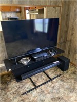 Approximately 44” tv with dvd player, sound bar
