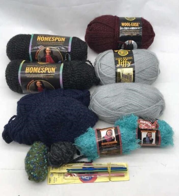 Lion Yarn & 4 Crochet Hooks Of Different Sizes