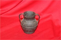 A Small Bronze Urn