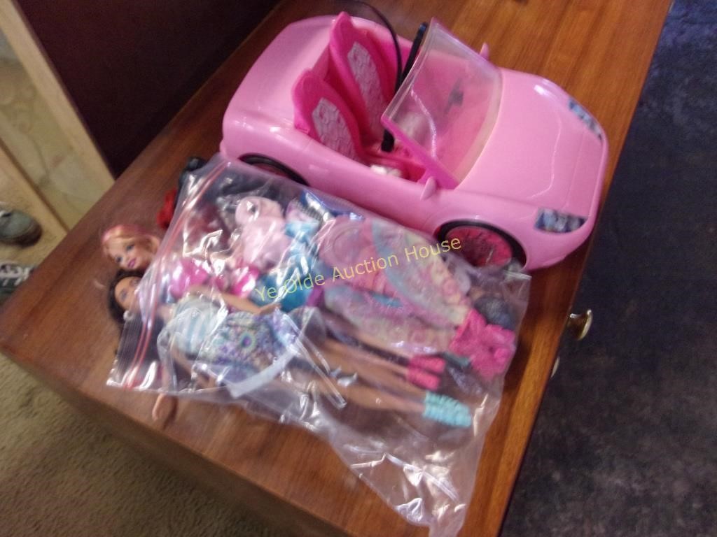 Grouping of Barbies including Vehicle