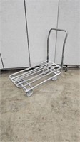 GREY METAL PIPE STOCK CART ON WHEELS