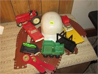 Toy tractor and helmet