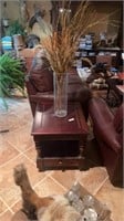 All wooden end table includes vase on top