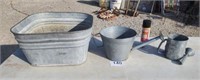 Galvanized wash tub & water cans.