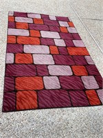 Purple/orange area rug