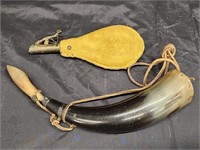 Powder flask and powder horn.  Look at the photos