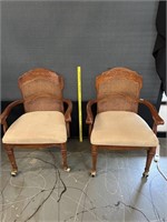 Two Cane Back Arm Chairs On Rollers