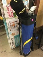 Golf bag with some clubs.