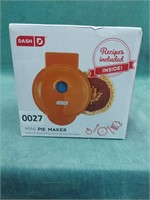 Dash 4" mini pie maker in orange. It comes