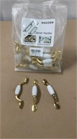 Brass and white cabinet handles, 32 pcs