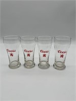 Four Coors glasses