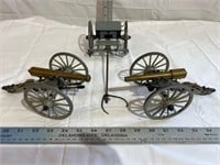 Two miniature brass cannons and wagon