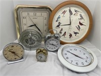Collection of wall and table clocks. Some need
