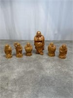 Six small carved Buddahs represting the