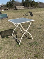 METAL OUTDOOR TABLE AND 4 PLASTIC CHAIRS