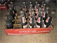 Wood coca cola crate with bottles