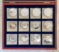 Set of 12 .999 Silver 20g collector coins in case.
