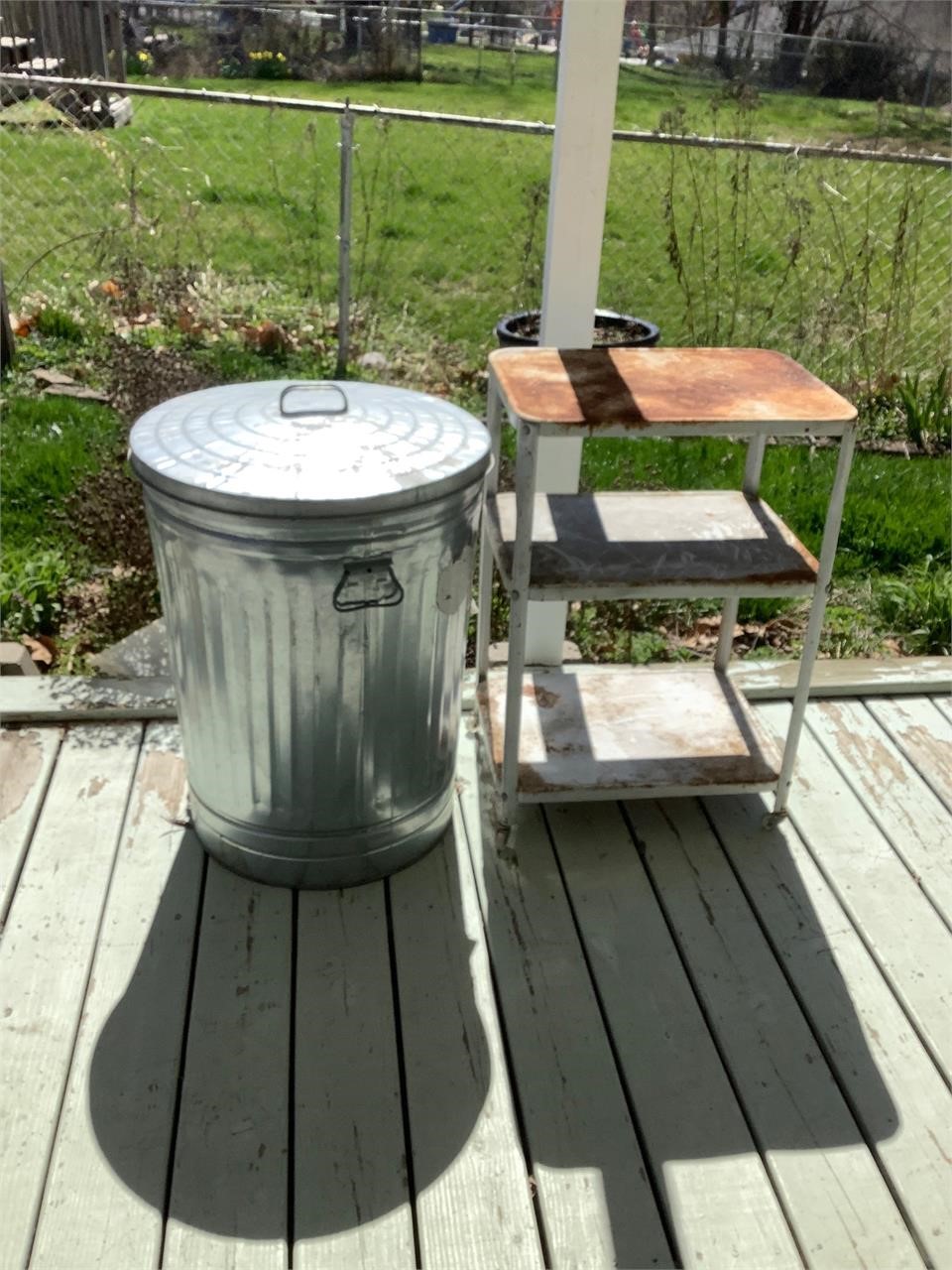 Metal trash can and vintage cart
