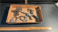 VINTAGE TOY GUNS AND HANDCUFFS