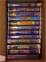 Box of Disney vhs tapes &more