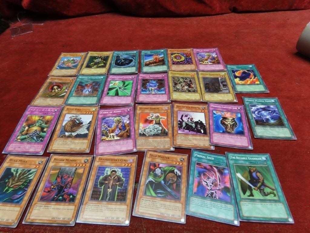 (26)Assorted Yu Gi Oh! trading game cards.