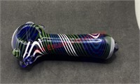 Glass pipe blue green and white stripes on a dark