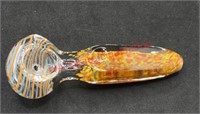 Glass pipe with orange and blue lines with red