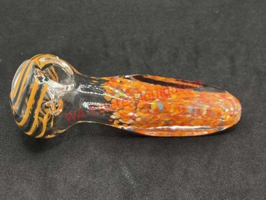Glass pipe with orange and black swirls on the