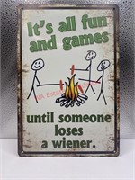 It’s all fun and games tin sign (livingroom)
