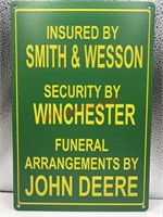 Insured by smith & Wesson tin sign (livingroom)