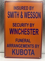 Insured by smith & Wesson kubota tin sign