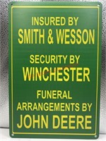 Insured by smith & Wesson tin sign (livingroom)