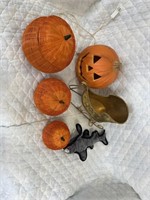 Four pumpkins, one Christmas sleigh, one dog toy
