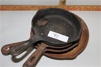 4 small cast iron pans