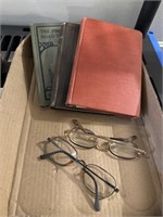 Antique books and eyeglasses