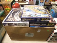 12  NEW SEALED PUZZLES
