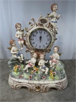 Porcelain dove and floral mantle clock, 19 inches