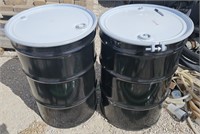 2 black 55 gallon metal drums