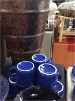 Eight blue coffee mugs