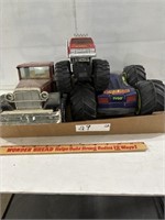 Flat of Plastic and Tin Toy Trucks