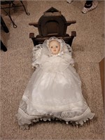 Doll in Christening Gown in Antique Doll Bed
