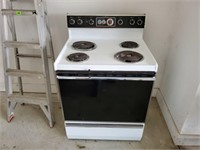 General Electric electric stove with cover
in