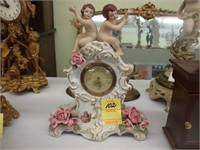 German Porcelain bedroom clock depicting cherubs