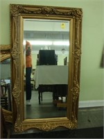 Large rectangular, beveled gilt wall mirror with