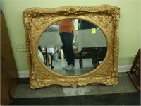 Large 19th century oval gilt wall mirror with