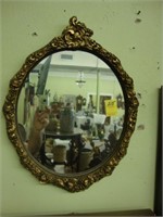 Oval floral Rococo gilt wall mirror