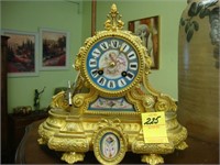 TOC gilt French clock with porcelain decoration